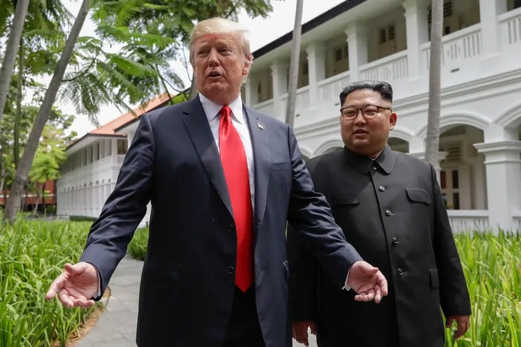 President Donald Trump and North Korea leader Kim Jong Un stop to talk with reporters during their meeting in June.