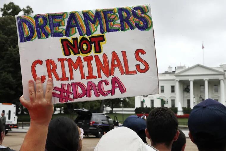 A protester holds up a sign in support of the Deferred Action for Childhood Arrivals Act (DACA) during an immigration reform rally in Washington.