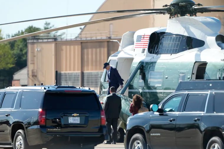 President Joe Biden arrives on Marine One at Andrews Air Force Base, Md., on Saturday. He cut short a beach weekend to meet with his national security team.