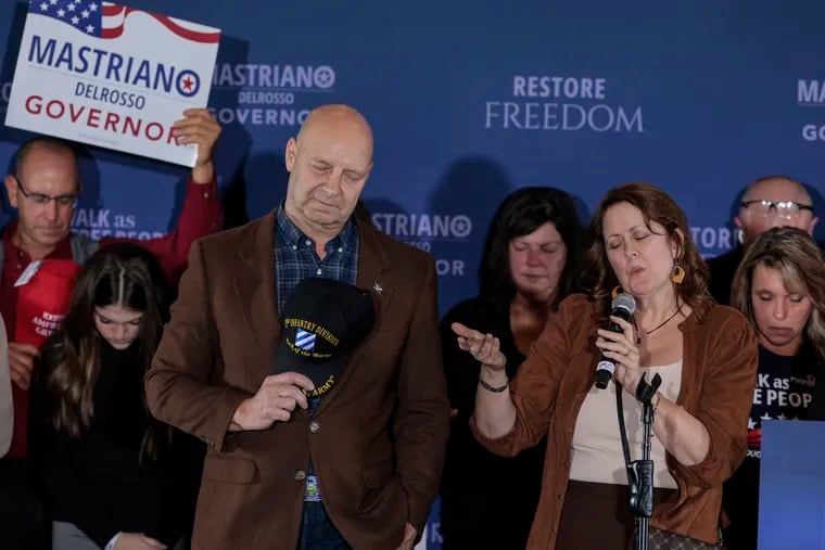 Republican Doug Mastriano and his wife Rebbie pray with supporters on election night in 2022 when Mastriano lost the race for Pennsylvania governor by double digits.