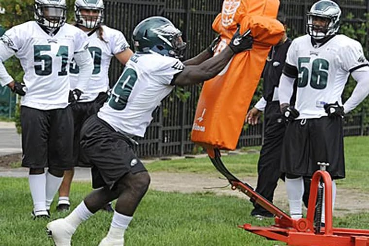 Brian Rolle, center, was probably the Eagles' most effective linebacker last season. (Clem Murray/Staff file photo)