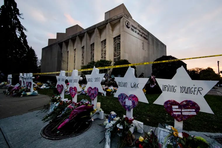 A makeshift memorial stands outside the Tree of Life synagogue in the aftermath of a deadly shooting in Pittsburgh, Oct. 29, 2018. A white man who gunned down 11 at the synagogue shared his antisemitic rants on Gab, a site that attracts extremists.