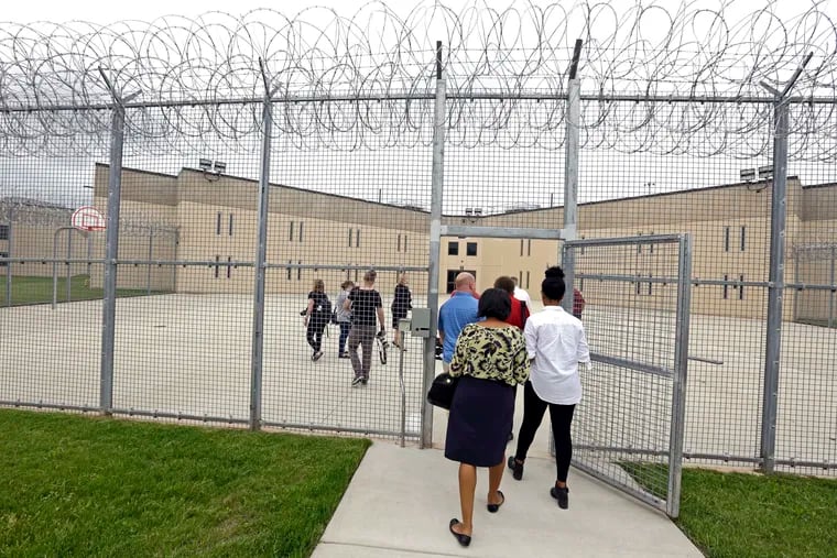 A group enters block D in the west section of the State Correctional Institution at Phoenix in Collegeville, Pa.