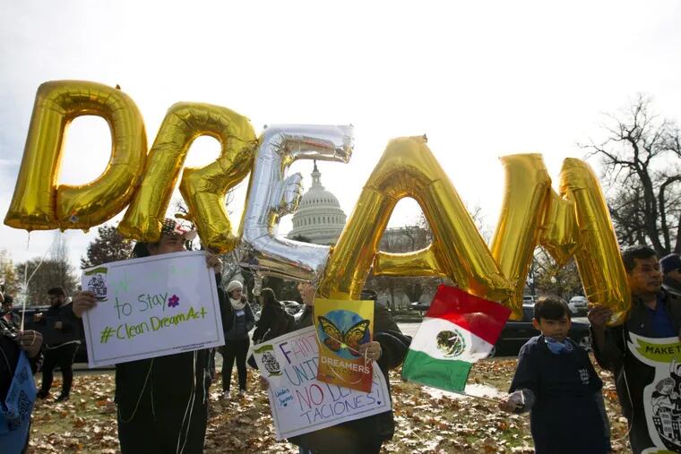 Demonstrators hold up balloons during an immigration rally in support of the Deferred Action for Childhood Arrivals (DACA), and Temporary Protected Status (TPS), programs, near the U.S. Capitol in Washington, Wednesday, Dec. 6, 2017.