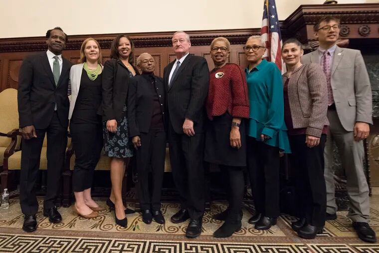 Mayor of Philadelphia, Jim Kenney, center, poses for a photograph with newly introduced school members, from left, Wayne Walker, Mallory Fix Lopez, Angela McIver, Julia Danzy, Joyce Wilkerson, Leticia Egea-Hinton, Maria McColgan and Lee Huang. The new school board members were introduced during a press conference at the City Hall on Wednesday, April, 4, 2018.