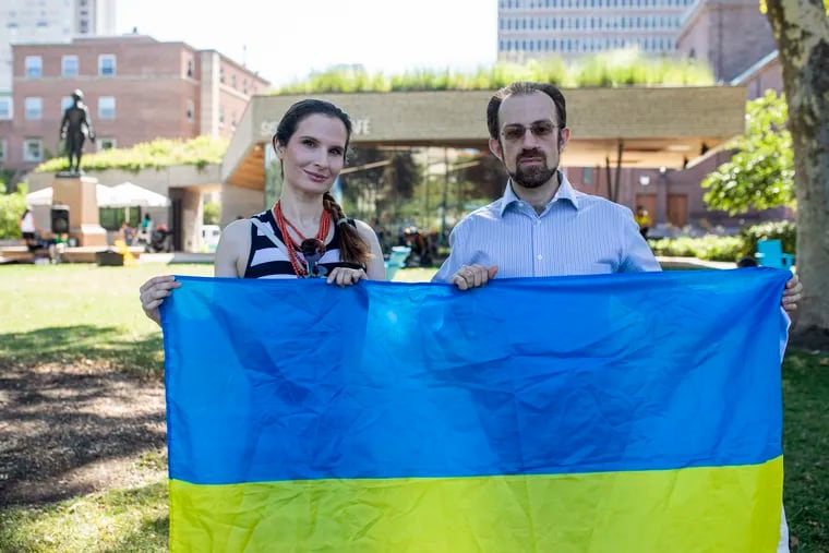 Marianna Tretiak, of Fairmount, a leader in the Ukrainian National Women’s League of America, (left), and Ilya Knizhnik, of West Philadelphia, Pa., of Ukraine Trust Chain and Philly Stands with Ukraine, (right), pose for a photo at Sister Cities Park, in Philadelphia, Pa., on Wednesday, Aug., 3, 2022.