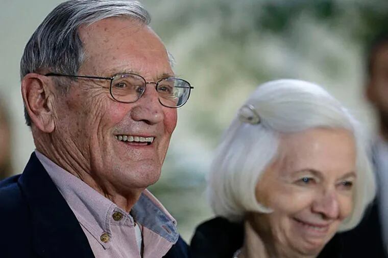 Merrill Newman, 85, with his wife, Lee, after he arrived at San Francisco International Airport on Saturday. (Associated Press)
