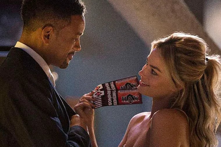 Con artist couple: Will Smith takes Margot Robbie under his wing and the two get romantically involved in the heist film &quot;Focus.&quot; (FRANK MASI)