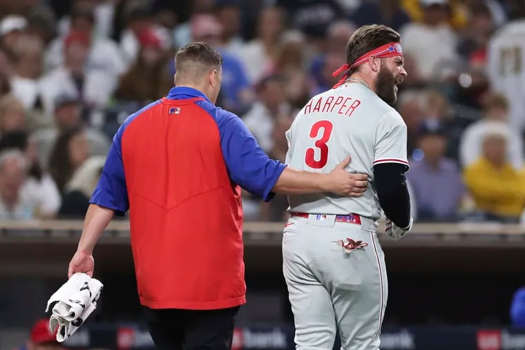 Bryce Harper leaves the field after getting hit by a pitch thrown by the Padres' Blake Snell on Saturday night.
