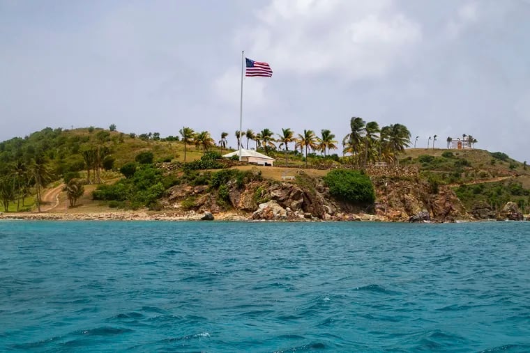 This Tuesday, July 9, 2019 photo shows a view of Little St. James Island, in the U. S. Virgin Islands, a property owned by Jeffrey Epstein. The 66-year-old billionaire bought the island more than two decades ago and began to transform it, clearing the native vegetation, ringing the property with towering palm trees and planting two massive U.S. flags on either end.