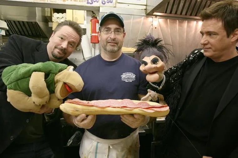 A mouthful - or a handful? In Atlantic City for gigs, Terry Fator (animating Winston) and Rick Skye (resuscitating Madame) visit the White House Sub Shop. Sandwiched between them yesterday was employee Ralph Pileggi.