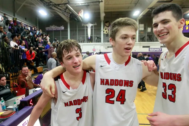 Haddonfield players Mike DePersia (left), Aiden Blake (center) and Dan Fleming celebrate after last season's South Jersey Group 2 tournament victory over Camden. All three athletes are back for the No. 2 team in the preseason Top 25.