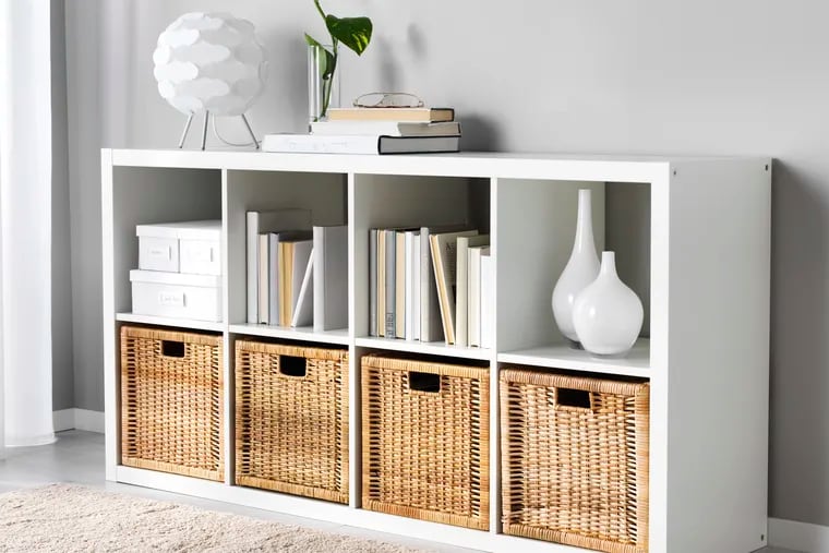 Ikea’s modular Kallax shelves can be stacked and rearranged to form flexible storage zones.