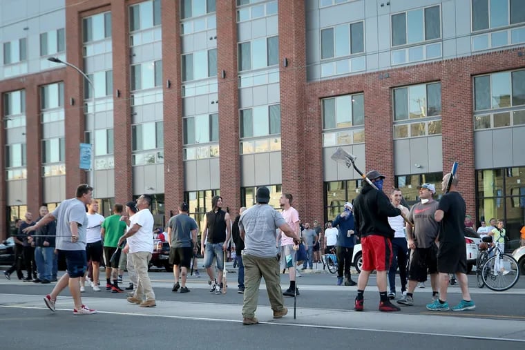 A group, who called themselves old-time Fishtowners, walk  on Girard Avenue carrying bats, hammers and shovels in Philadelphia, Pa. on June 1, 2020. The men said they believed they were protecting their neighborhood in the event looters or rioters showed up in Fishtown.