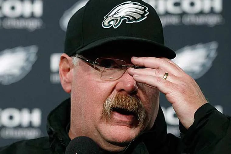 Andy Reid gestures during a news conference after the Eagles' NFL football game against the Washington Redskins, Sunday, Dec. 23, 2012, in Philadelphia. Washington won 27-20. (Michael Perez/AP)