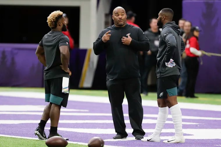 With Miles Sanders (right) out, running backs coach Duce Staley is going to have to coach up Boston Scott (left).