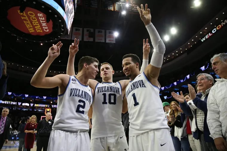 Villanova’s Collin Gillespie, left, Donte DiVincenzo, center, and Jalen Brunson, right, salute the students section after their victory over Butler. Villanova wins 86-75 over Butler at the Wells Fargo Center in Philadelphia on February 10, 2018.