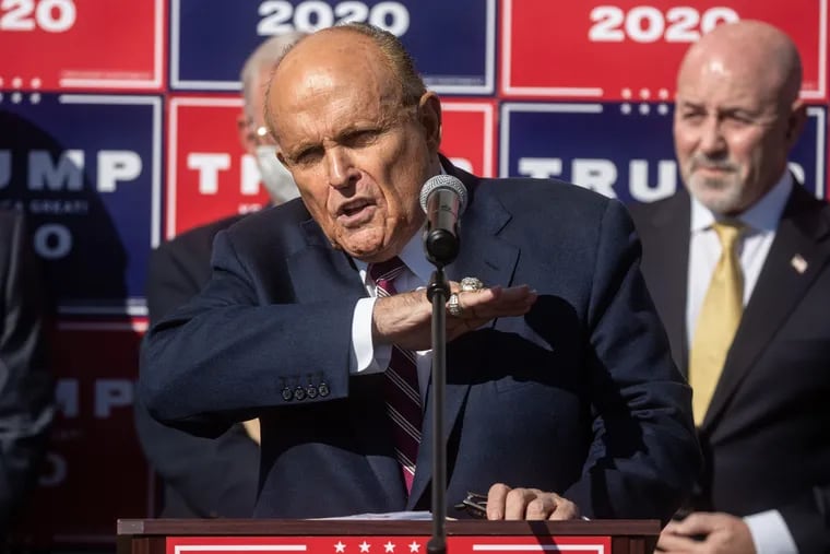 Rudy Giuliani speaks to the media at a Nov. 7 news conference held in the back parking lot of Four Seasons Total Landscaping in Philadelphia.