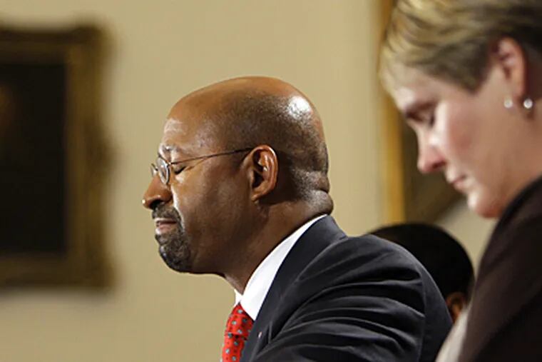 Mayor Michael Nutter, joined by DHS commissioner Anne Marie Ambrose, pauses at a news conference yesterday on the city's handling of Danieal Kelly's death. (AP)