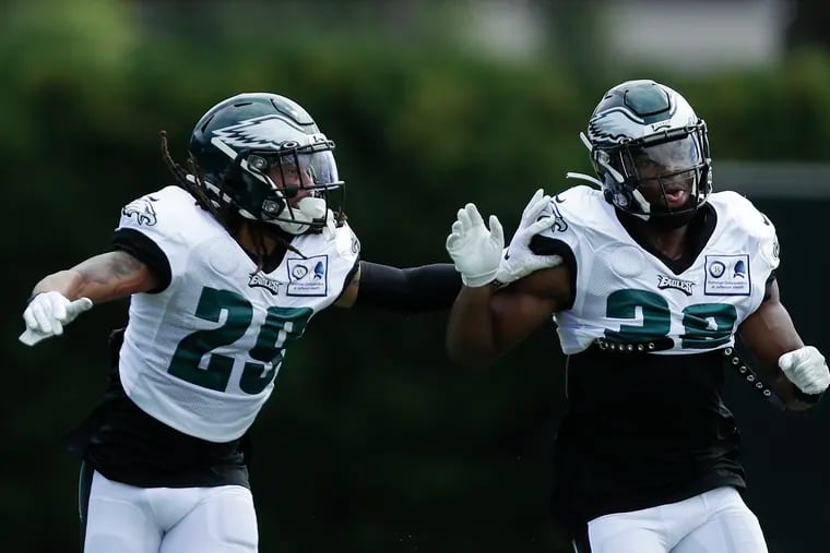 Eagles cornerback Avonte Maddox (left) works with teammate Rudy Ford during a coverage drill at practice Monday at the NovaCare Complex.