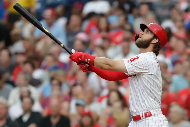 Harper, here batting against the Mets on June 24, 2019, has hustled and won over his new Phillies teammates.