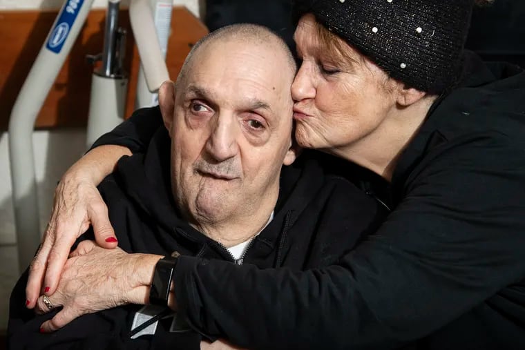Sharon Gaiptman kisses her brother Lenny at his home in Philadelphia.