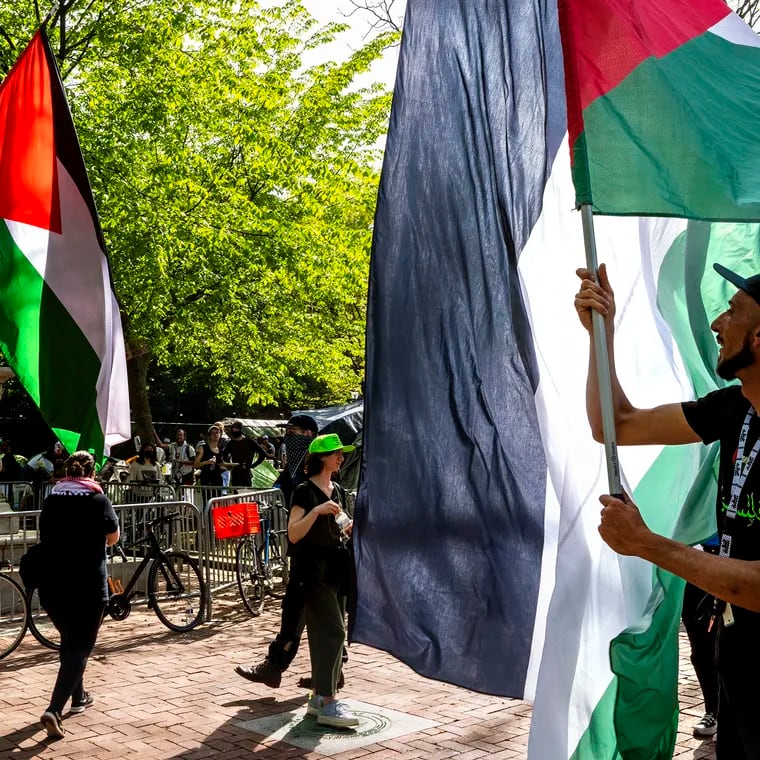 Large Palestinian flags arrive at the tent encampment protest at the University of Pennsylvania on Sunday.
