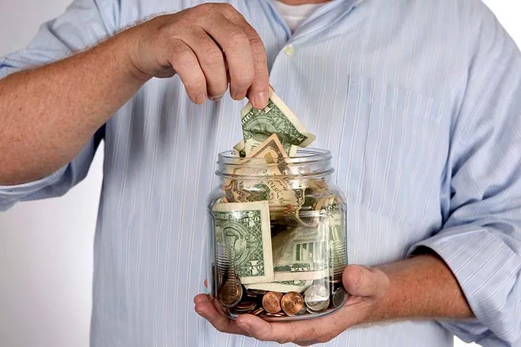 Retiree withdraws money from his savings, bank, or IRA account piggy bank concept. The financial planning workshops will be held at the Campaign for Working Families’ offices at 1415 North Broad Street, Suite 223, Philadelphia, 19122.