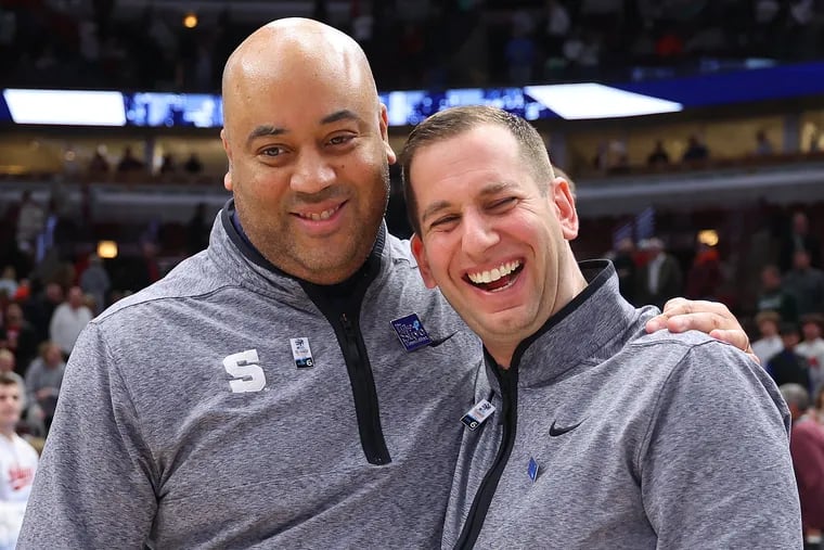 Micah Shrewsberry celebrates with assistant Adam Fisher after Penn State defeats Indiana.