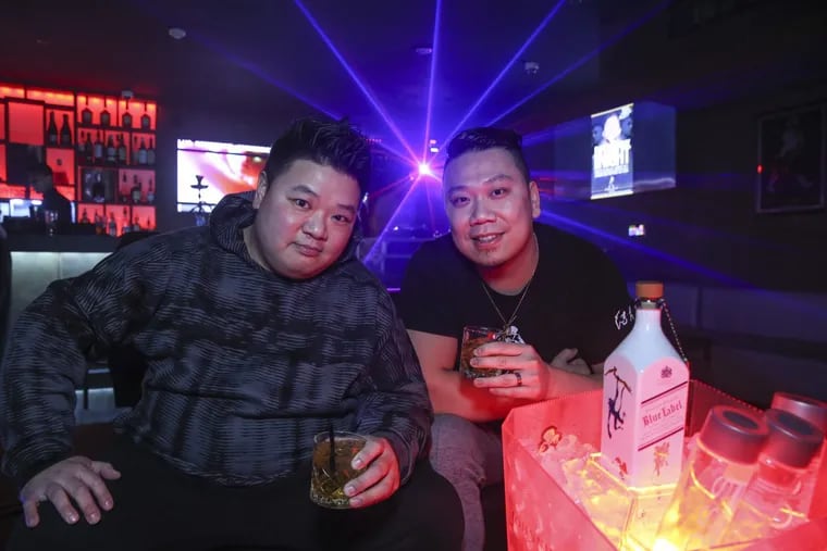 Kenny Poon, left and his biz partner Dave Taing in the Johnnie Walker Lounge upstairs at Chinatown Square, Thursday, January 25, 2018.