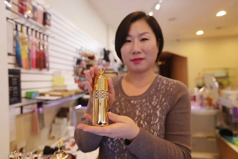 Ga-In BeautyZone owner Jeanne Lee shows off the History of Whoo’s signature ampoule, which costs a whopping $1,100.