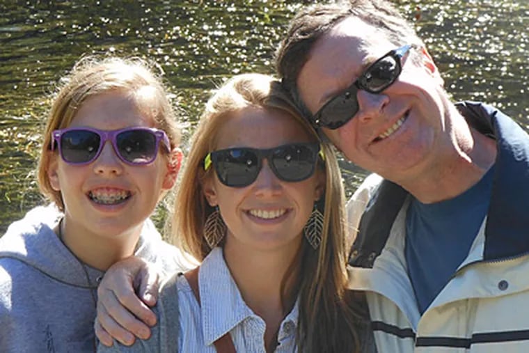 Eric Swan - with daughters Emily (left) and Erica - is recovering from a brain stem stroke.