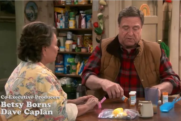 Screenshot of the revival premiere of “Roseanne,” in which the show’s namesake and husband Dan divvy up prescription medications.
