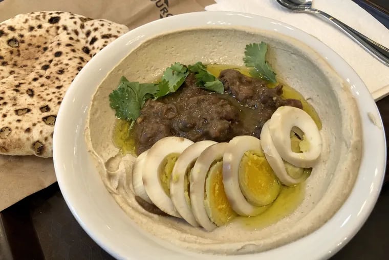 Hummus foul, or stewed fava beans, at Merkaz.