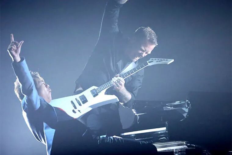 Classic rock: Concert pianist Lang Lang with Metallica guitarist James Hetfield, performing the heavy-metal band's song "One" at the Grammy Awards last Sunday. (Matt Sayles/Invision)