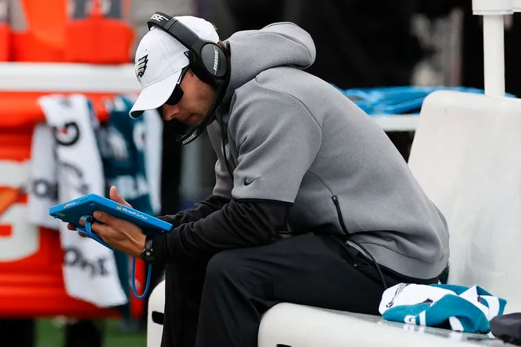 Eagles Defensive Coordinator Jonathan Gannon looks at his tablet while the Eagles played the New Orleans Saints on Sunday, November 21, 2021 in Philadelphia.