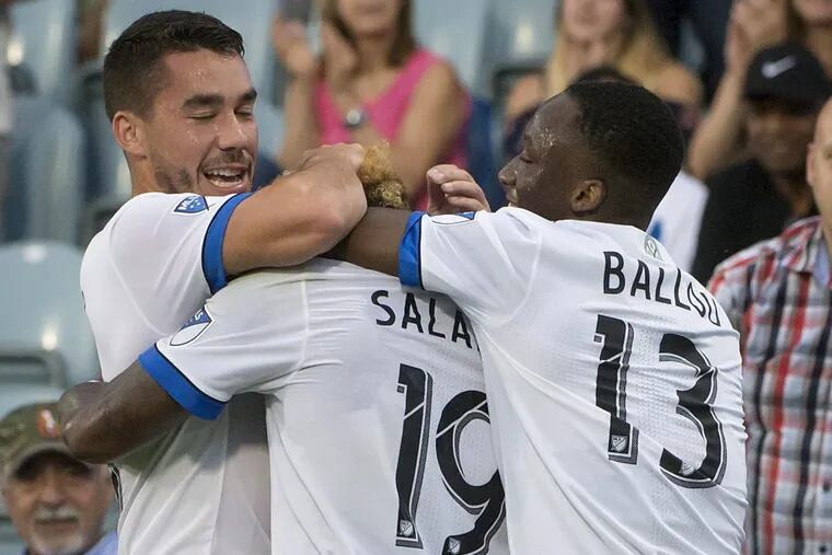 The Montreal Impact’s Michael Salazar (19) is hugged by teammates after scoring against the Union on Wednesday.