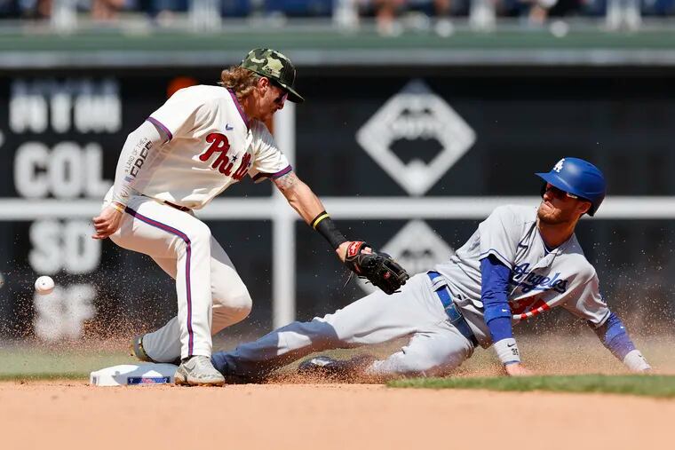 Los Angeles Dodgers Cody Bellinger steals second base as the ball gets past Phillies shortstop Bryson Stott in the seventh inning on Sunday, May 22, 2022 in Philadelphia.