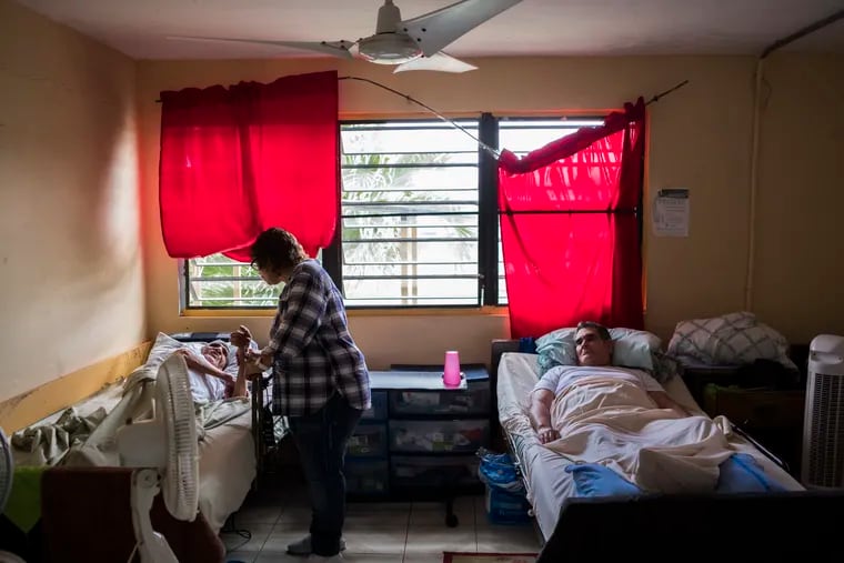 Myrna Izquierdo visits patients at Casa Ismael, the clinic she runs in Toa Baja, Puerto Rico.