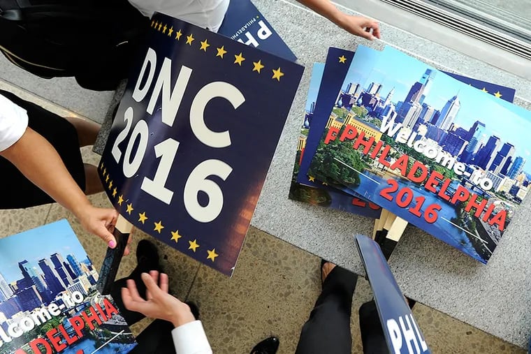 Placards pushed to bring the Democratic National Convention to Philadelphia in 2016. TOM GRALISH / Staff Photographer