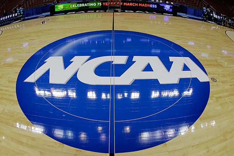 The NCAA logo is shown before Albany's practice for a second-round game of the NCAA college basketball tournament, Thursday, March 21, 2013, in Philadelphia. (Matt Slocum/AP file)