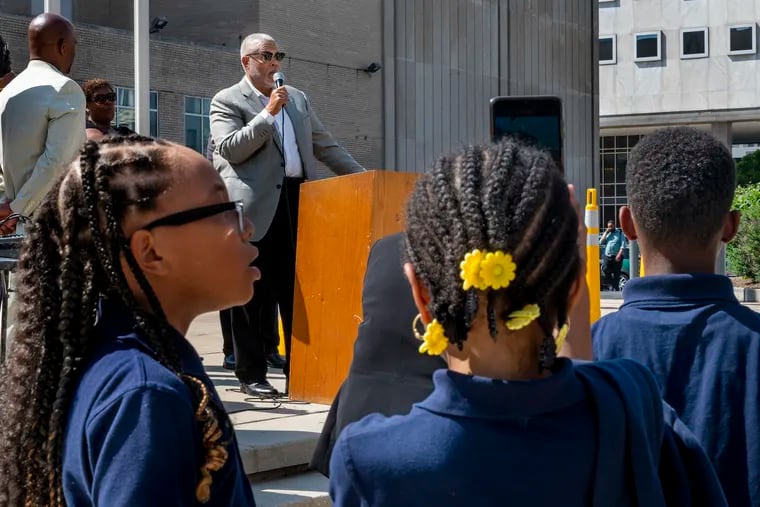 State Sen. Anthony Williams speaks during a protest by the African American Charter School Coalition outside School District headquarters Thursday. Students from West Philadelphia Achievement Charter Elementary School attended the event held by the coalition, which says the board has a double standard in rejecting and closing Black-led charters.