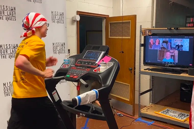 In this Aug. 23, 2020 photo, Sister Stephanie Baliga runs a marathon on a treadmill in the basement of the Mission of Our Lady of the Angels church in Chicago. When the Chicago Marathon was canceled due to the coronavirus pandemic, Sister Baliga and her fellow nuns livestreamed the race and raised money for their community. (PJ Weiland via AP)