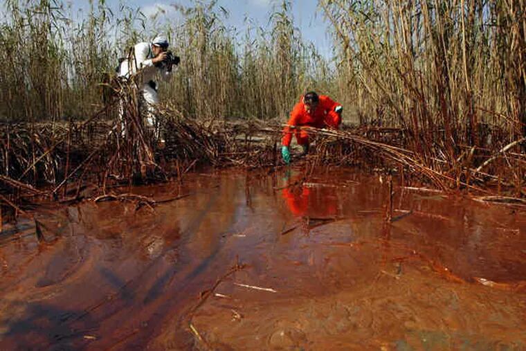 Anger has grown as oil has started washing into coastal wetlands in Louisiana. Lindsey Allen of Greenpeace took water samples Friday in Venice, La. A BP spokesman said that the company was putting equipment in place and completing tests.