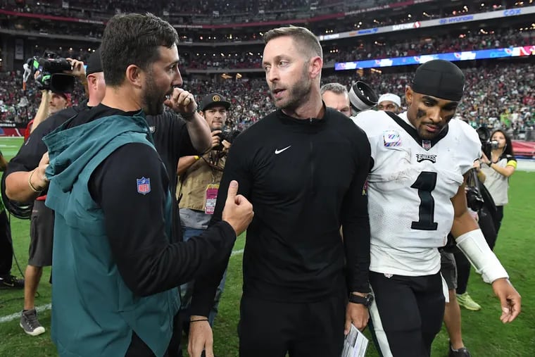 Head coach Nick Sirianni of the Philadelphia Eagles talks to head coach Kliff Kingsbury of the Arizona Cardinals while Jalen Hurts walks by after Philadelphia's 20-17 win at State Farm Stadium on October 09, 2022 in Glendale, Arizona. (Photo by Norm Hall/Getty Images)