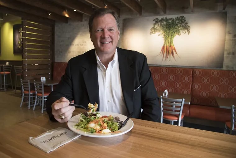 Patrick Sugrue, 57,  chief executive of Saladworks, gets ready to eat a salad at a restaurant in Southampton. CLEM MURRAY / Staff Photographer