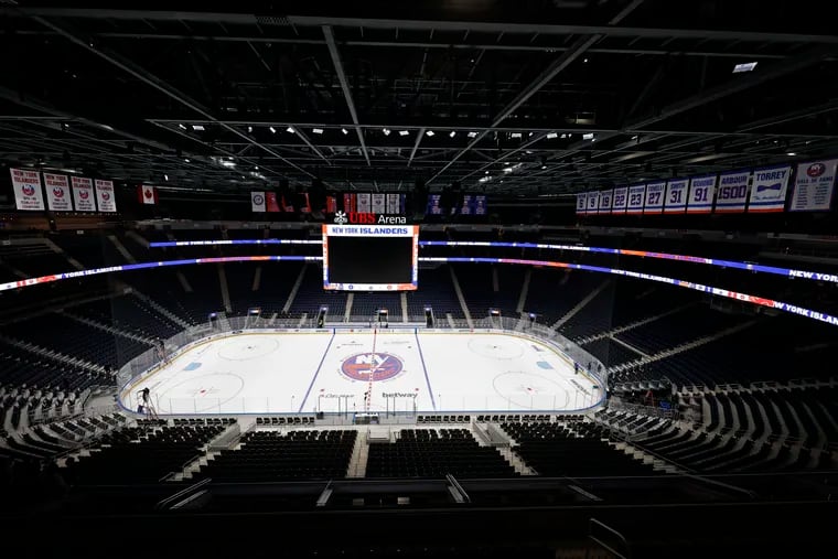 The new UBS Arena sits empty before the first New York Islanders NHL hockey game against the Calgary Flames, Saturday, Nov. 20, 2021, in Elmont, N.Y. (AP Photo/Adam Hunger)