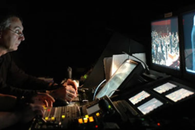 Paul Taylor, a technician for the Philadelphia Orchestra, monitors performers from a control room at the Kimmel Center. The technology the orchestra uses allows for multicasts with relatively small overhead costs.