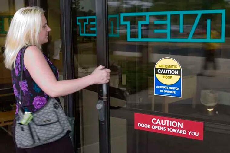 An unidentified employee enters Teva Headquarters in North Wales.   (Photo by Clem Murray / Inquirer)