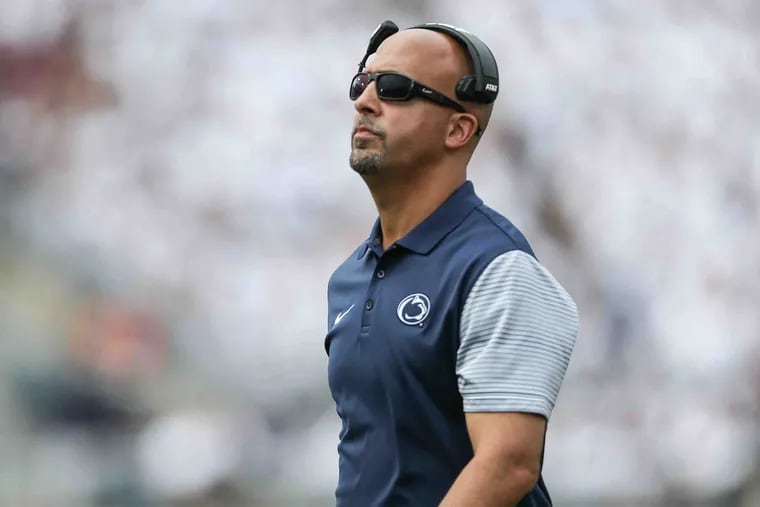 Penn State's head coach James Franklin looks up at the video screen during his game against Temple in the 4th quarter in State College, Saturday September 17, 2016.   Penn State beats Temple 34-27.STEVEN M. FALK / Staff Photographer